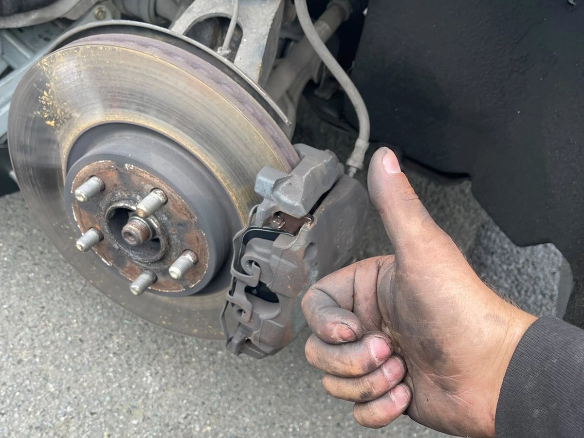 The front brake back together with the caliper refitted over the new pads