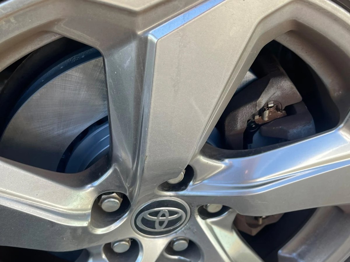 The alloy wheel refitted, with the new disc and the caliper visible through the spokes